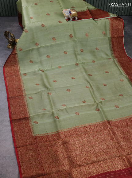 Banarasi organza saree pastel green and rust shade with woven buttas and banarasi style border