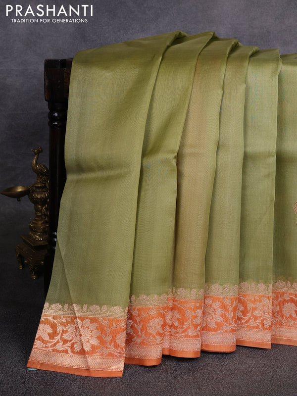 Banarasi organza saree pastel green and orange with zari woven buttas and zari woven border