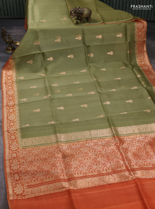 Banarasi organza saree pastel green and orange with zari woven buttas and zari woven border
