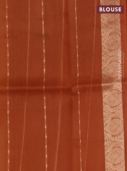 Banarasi organza saree pastel green and orange with zari woven buttas and zari woven border
