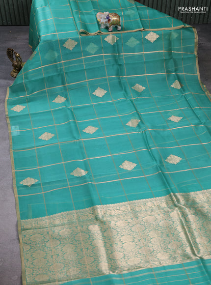Banarasi organza saree teal green with allover zari checks & buttas and zari woven piping border