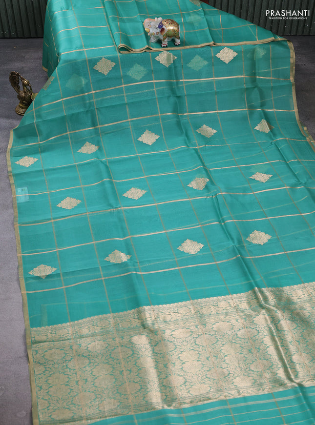 Banarasi organza saree teal green with allover zari checks & buttas and zari woven piping border