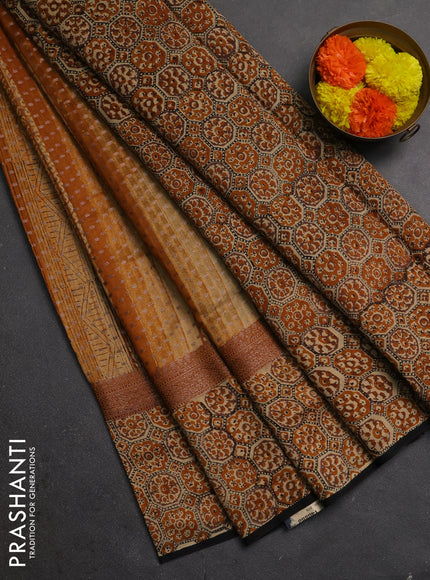 Chanderi silk cotton saree dark mustard and black with allover prints & banarasi weaves and banarasi style printed border