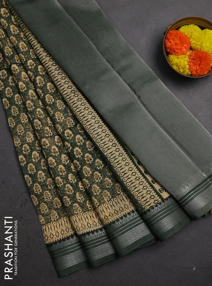 Chanderi silk cotton saree bottle green with allover prints and silver zari woven border