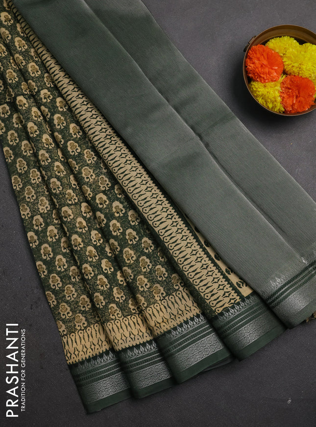 Chanderi silk cotton saree bottle green with allover prints and silver zari woven border
