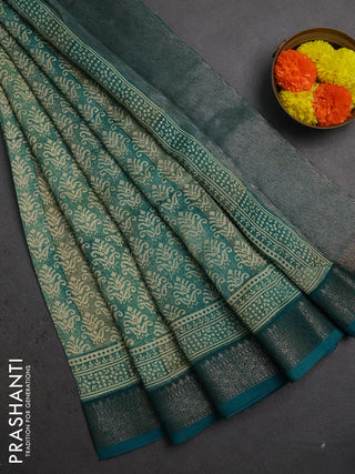 Chanderi silk cotton saree teal green with allover prints and banarasi style border