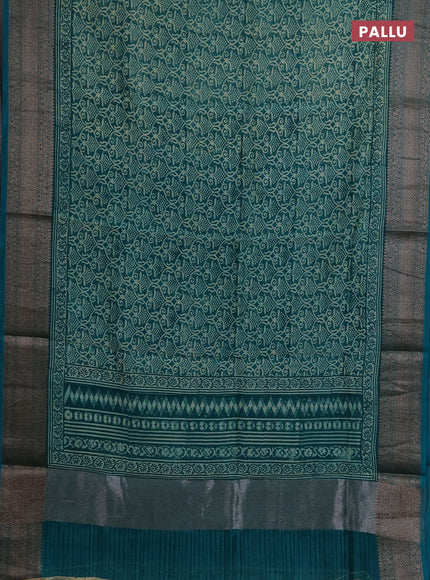 Chanderi silk cotton saree teal green with allover prints and banarasi style border