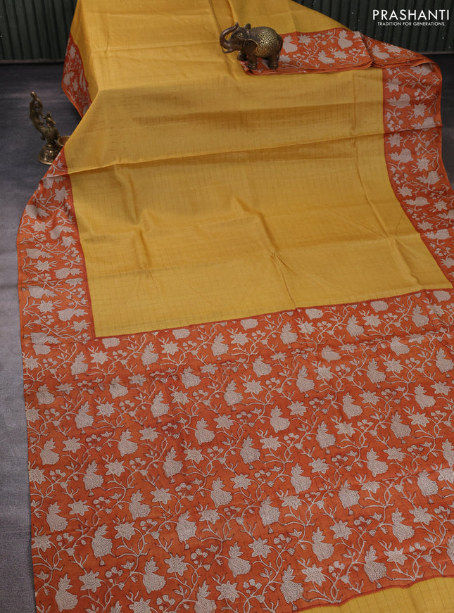 Pure tussar silk saree yellow and orange with allover zari checked pattern and block printed pallu & border