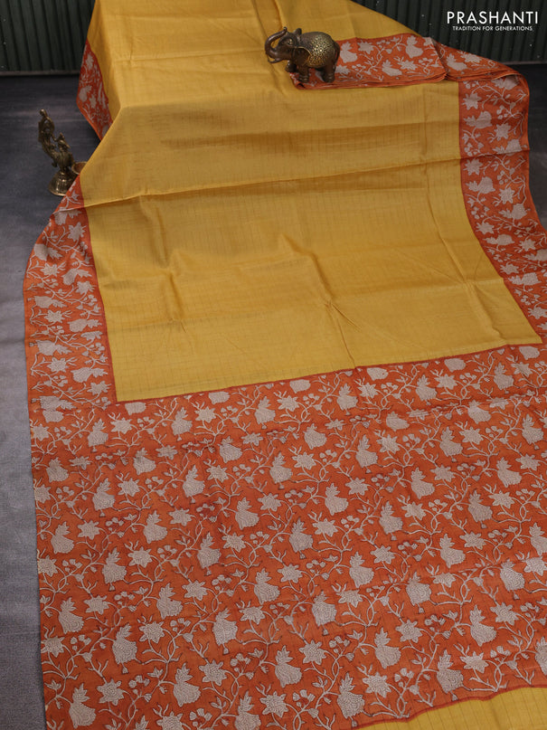 Pure tussar silk saree yellow and orange with allover zari checked pattern and block printed pallu & border