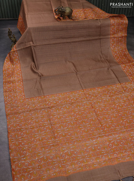 Pure tussar silk saree sandal and pale orange with allover zari checked pattern and block printed pallu & border