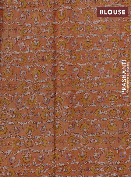Pure tussar silk saree sandal and pale orange with allover zari checked pattern and block printed pallu & border