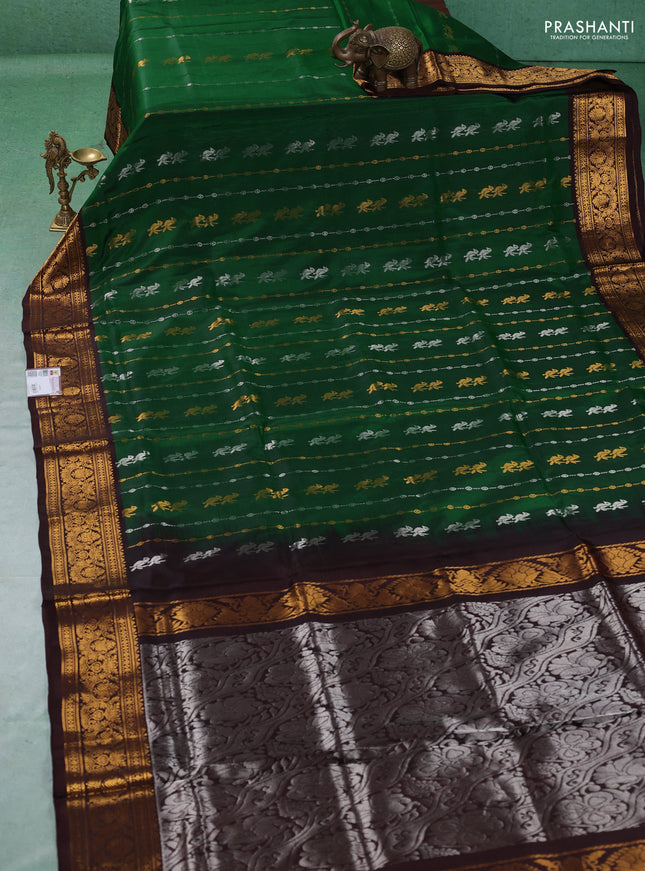 Pure uppada silk saree green and coffee brown with allover silver & gold zari weaves & buttas and zari woven border