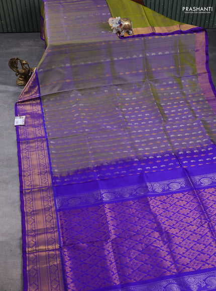 Pure uppada silk saree dual shade of green and violet with allover silver & gold zari woven buttas and zari woven border