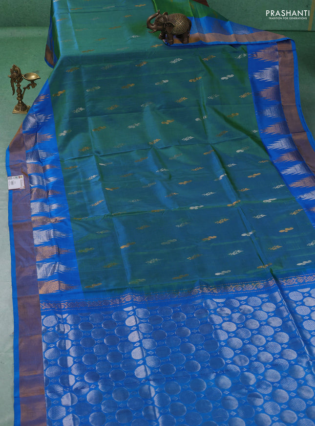 Pure uppada silk saree dual shade of greenish blue and cs blue with allover silver & gold zari woven buttas and temple design zari woven border