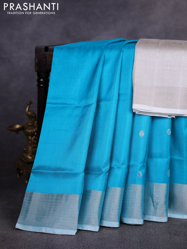 Pure uppada silk saree cs blue with allover silver zari woven coin buttas and rettapet zari woven border