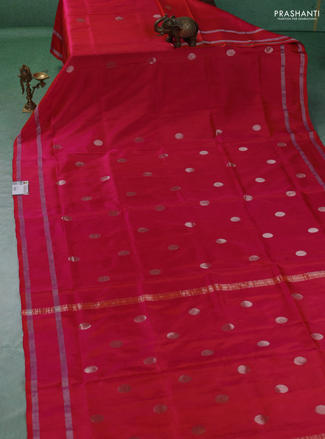 Pure uppada silk saree dual shade of pinkish orange with allover silver zari woven coin buttas and rettapet zari woven border