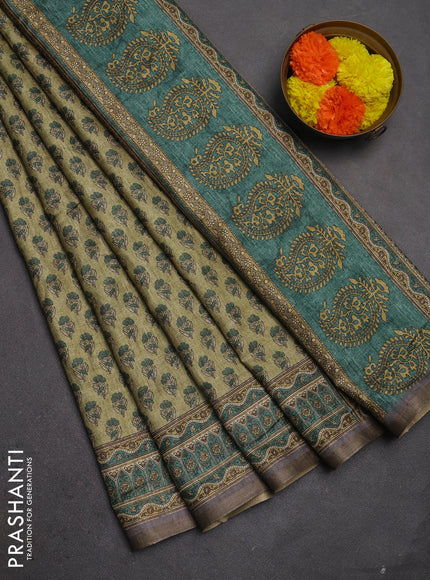 Semi tussar saree green and grey with allover floral buttas and printed zari woven border