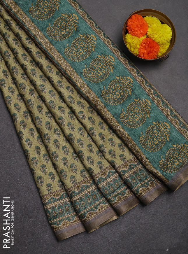 Semi tussar saree green and grey with allover floral buttas and printed zari woven border