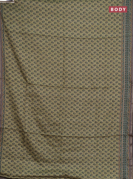 Semi tussar saree green and grey with allover floral buttas and printed zari woven border