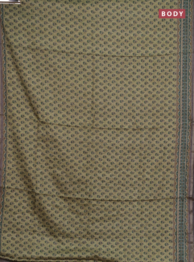 Semi tussar saree green and grey with allover floral buttas and printed zari woven border