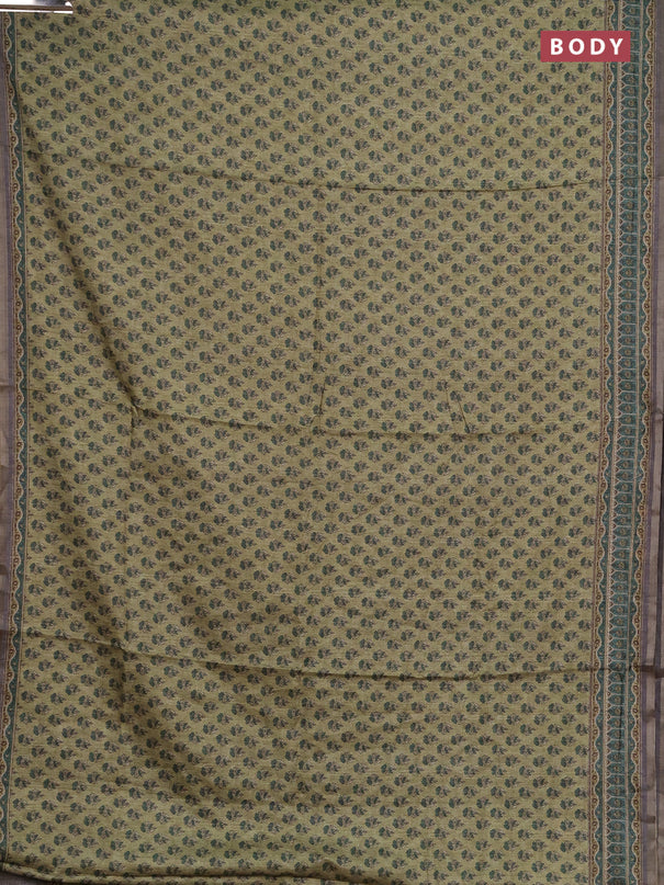 Semi tussar saree green and grey with allover floral buttas and printed zari woven border
