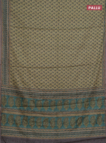 Semi tussar saree green and grey with allover floral buttas and printed zari woven border