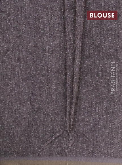 Semi tussar saree green and grey with allover floral buttas and printed zari woven border