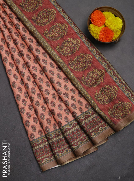Semi tussar saree peach orange and maroon with allover floral buttas and printed zari woven border