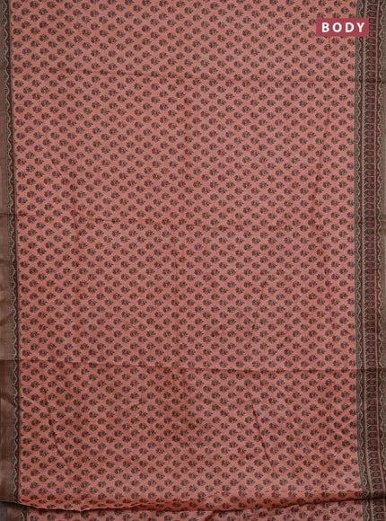Semi tussar saree peach orange and maroon with allover floral buttas and printed zari woven border