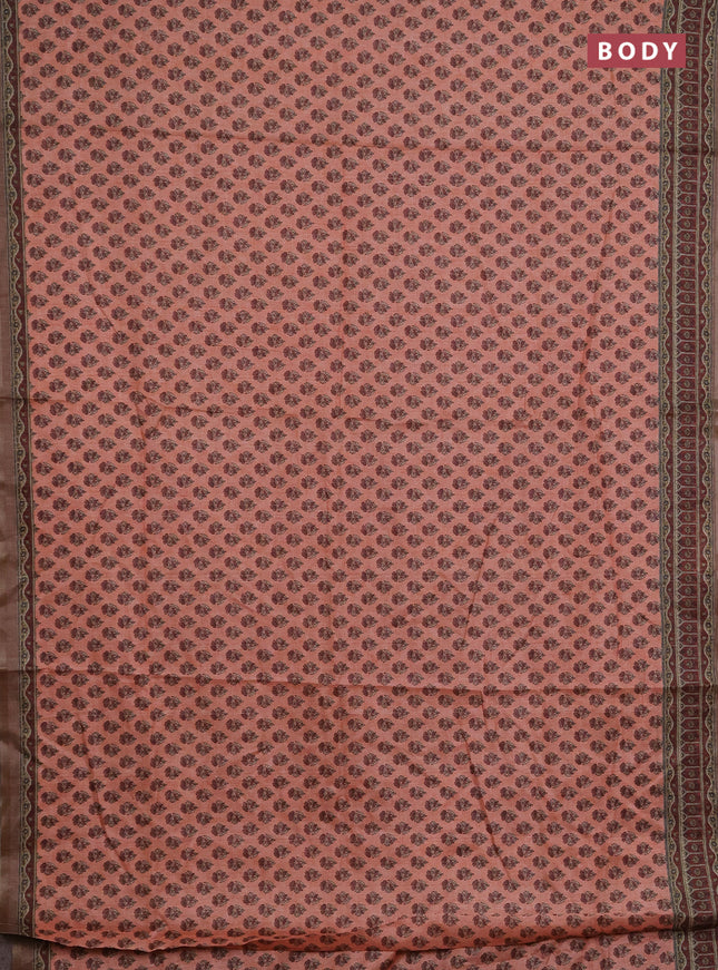 Semi tussar saree peach orange and maroon with allover floral buttas and printed zari woven border