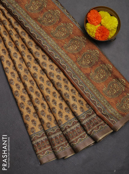 Semi tussar saree sandal and brown with allover floral buttas and printed zari woven border