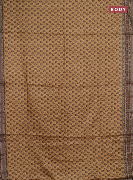 Semi tussar saree sandal and brown with allover floral buttas and printed zari woven border