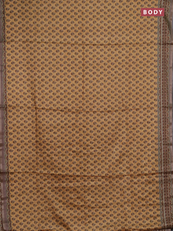 Semi tussar saree sandal and brown with allover floral buttas and printed zari woven border