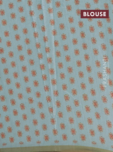 Semi tussar saree mild teal with allover floral digital prints and zari woven piping border