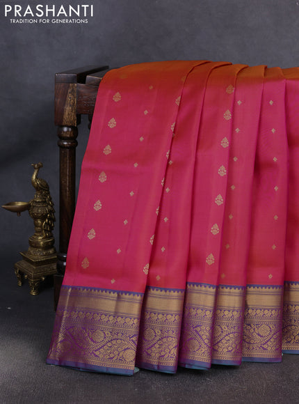 Pure soft silk saree dual shade of pinkish orange and dual shade of teal green with allover zari woven buttas and zari woven border