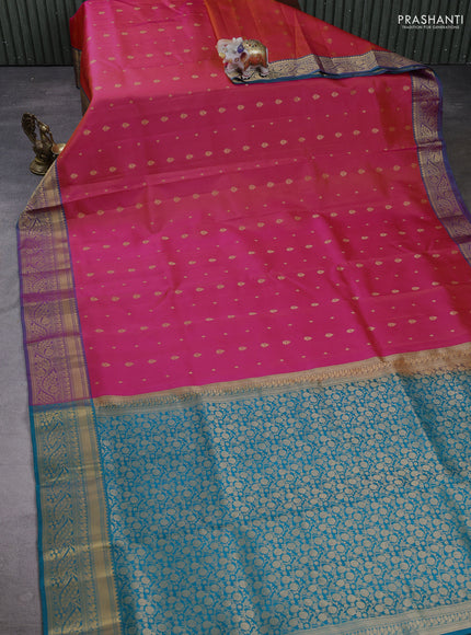 Pure soft silk saree dual shade of pinkish orange and dual shade of teal green with allover zari woven buttas and zari woven border