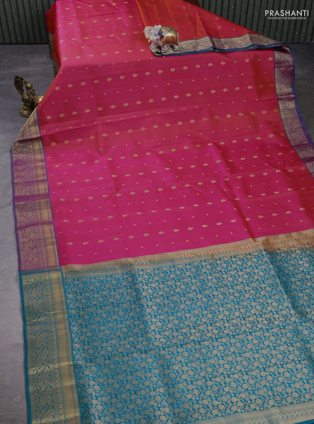 Pure soft silk saree dual shade of pinkish orange and dual shade of teal green with allover zari woven buttas and zari woven border
