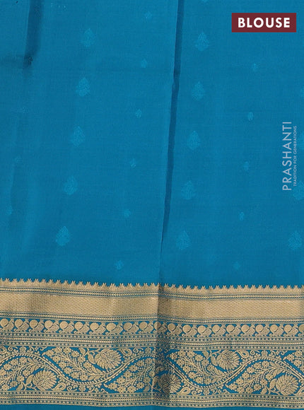 Pure soft silk saree dual shade of pinkish orange and dual shade of teal green with allover zari woven buttas and zari woven border