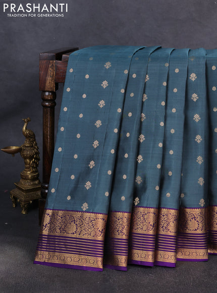 Pure soft silk saree teal blue shade and violet with allover zari woven buttas and zari woven border