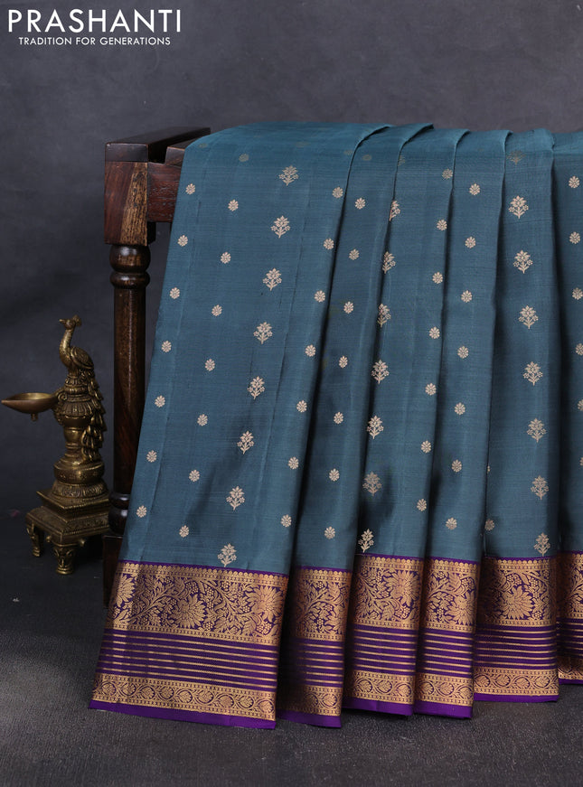 Pure soft silk saree teal blue shade and violet with allover zari woven buttas and zari woven border