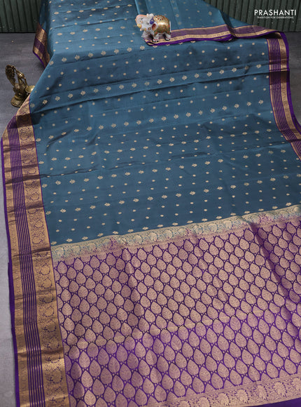 Pure soft silk saree teal blue shade and violet with allover zari woven buttas and zari woven border