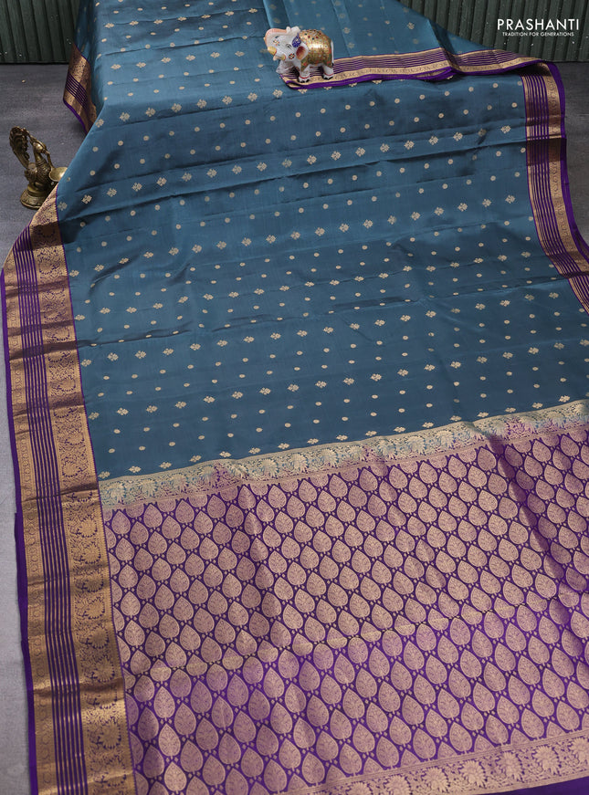 Pure soft silk saree teal blue shade and violet with allover zari woven buttas and zari woven border