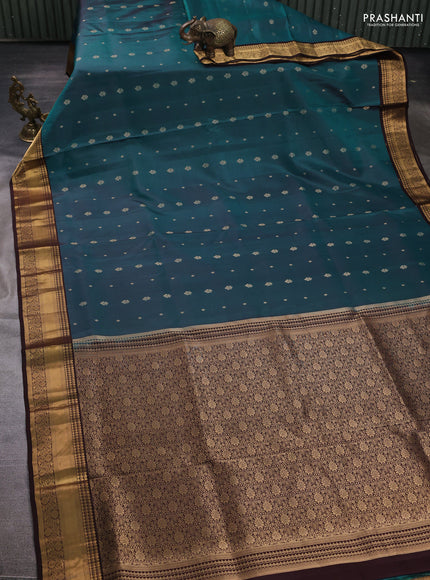 Pure soft silk saree peacock green and coffee brown with allover zari woven buttas and zari woven border