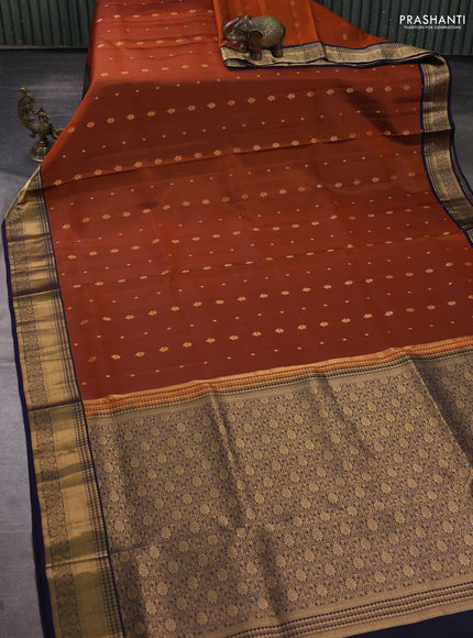 Pure soft silk saree rust shade and navy blue with allover zari woven buttas and zari woven border