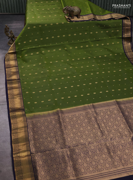 Pure soft silk saree mehendi green and navy blue with allover zari woven buttas and zari woven border
