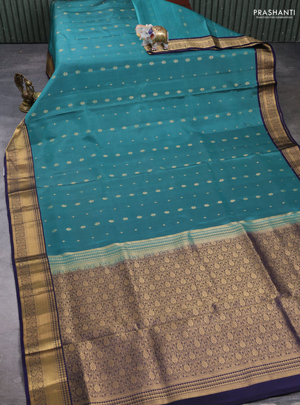 Pure soft silk saree green shade and navy blue with allover zari woven buttas and zari woven border