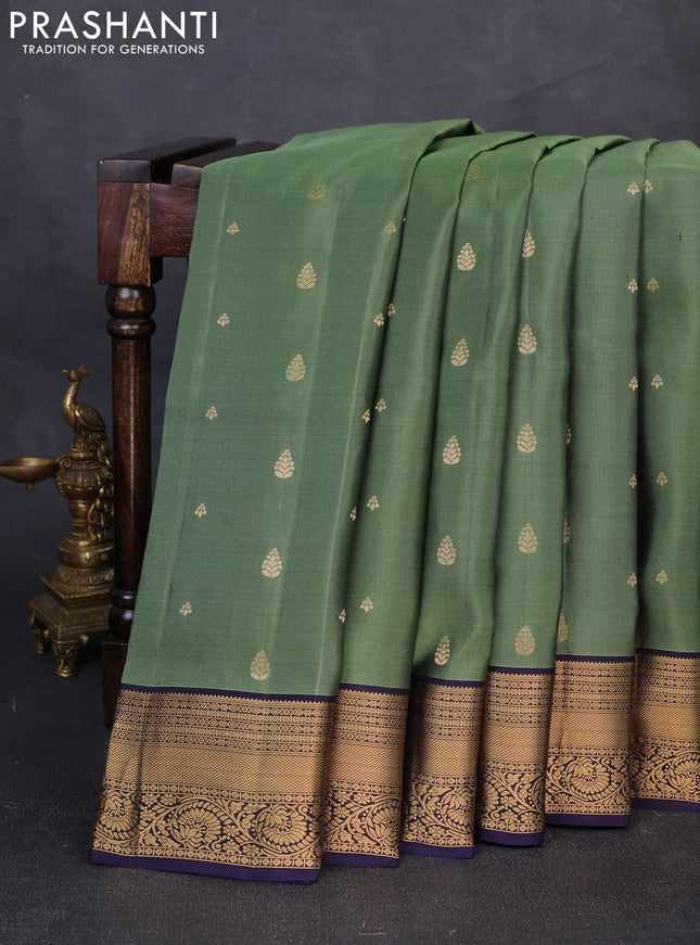 Pure soft silk saree elaichi green and navy blue with allover zari woven buttas and zari woven border