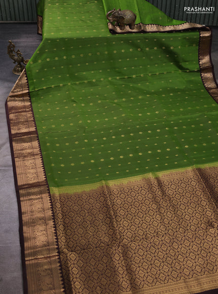 Pure soft silk saree green and coffee brown with allover zari woven buttas and zari woven border