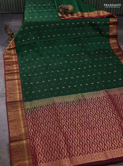 Pure soft silk saree bottle green and wine shade with allover zari woven buttas and zari woven border