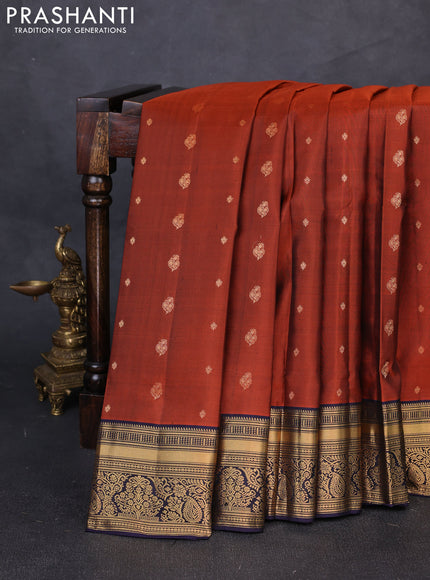 Pure soft silk saree rust shade and navy blue with allover zari woven buttas and zari woven border